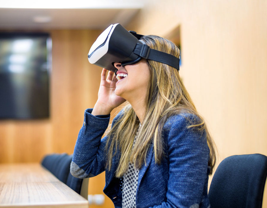 Young Woman wearing VR Headset, smiling happily