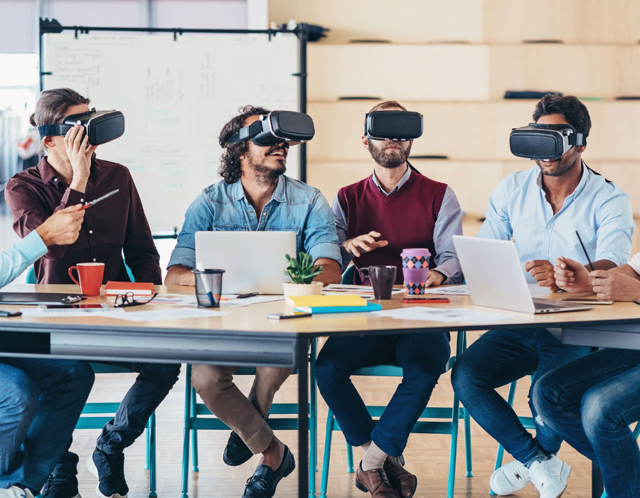 Group of men wearing VR headset in business casual clothes